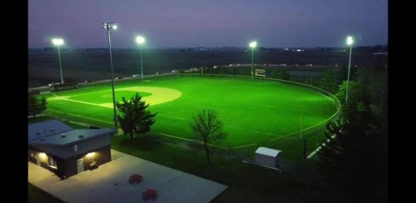 Picture of the softball field lit up at night